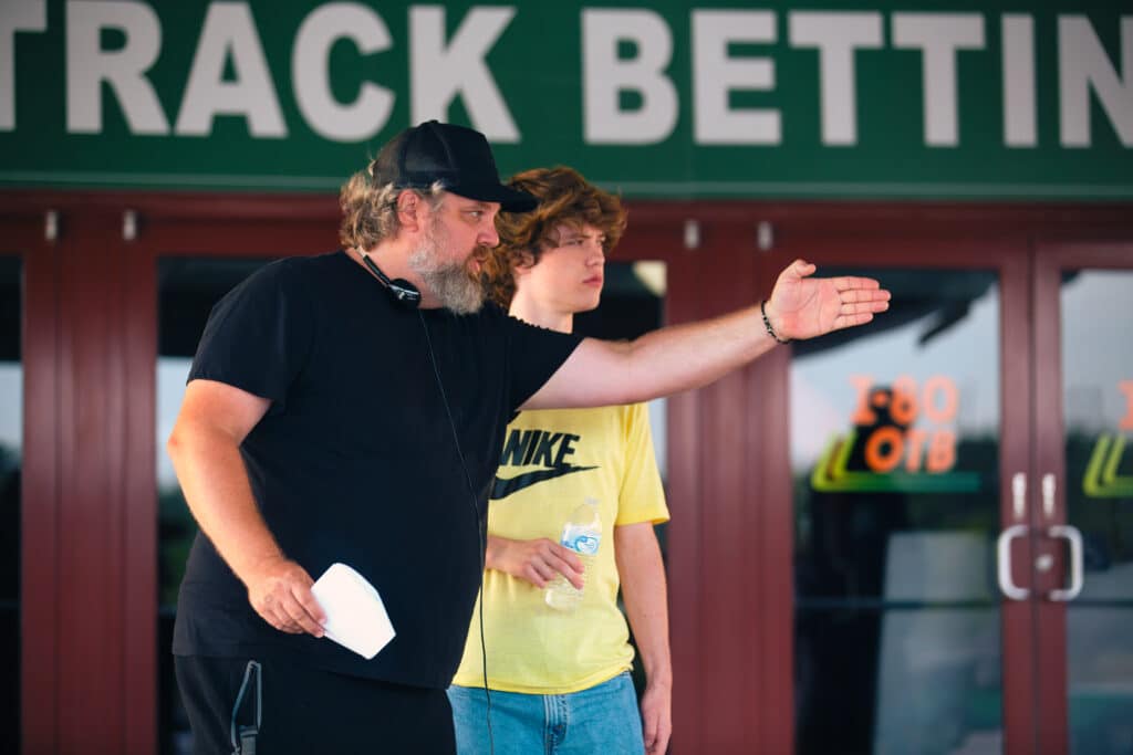 Adam Rehmeier on set directing Conor Sherry in a scene from Snack Shack